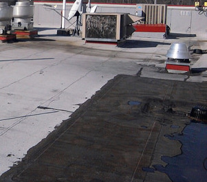 How And When To Inspect A Flat Roof Drain